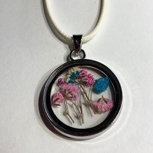 Pressed flower pendant with white cord